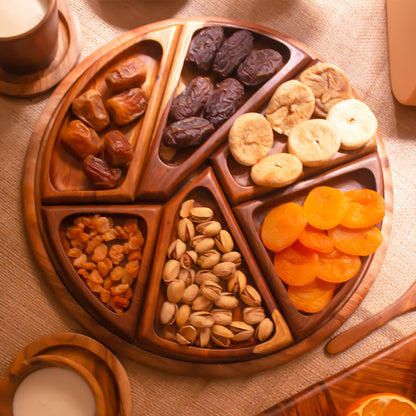 A wooden plate with six compartments, each filled with different types of nuts and dried fruits.